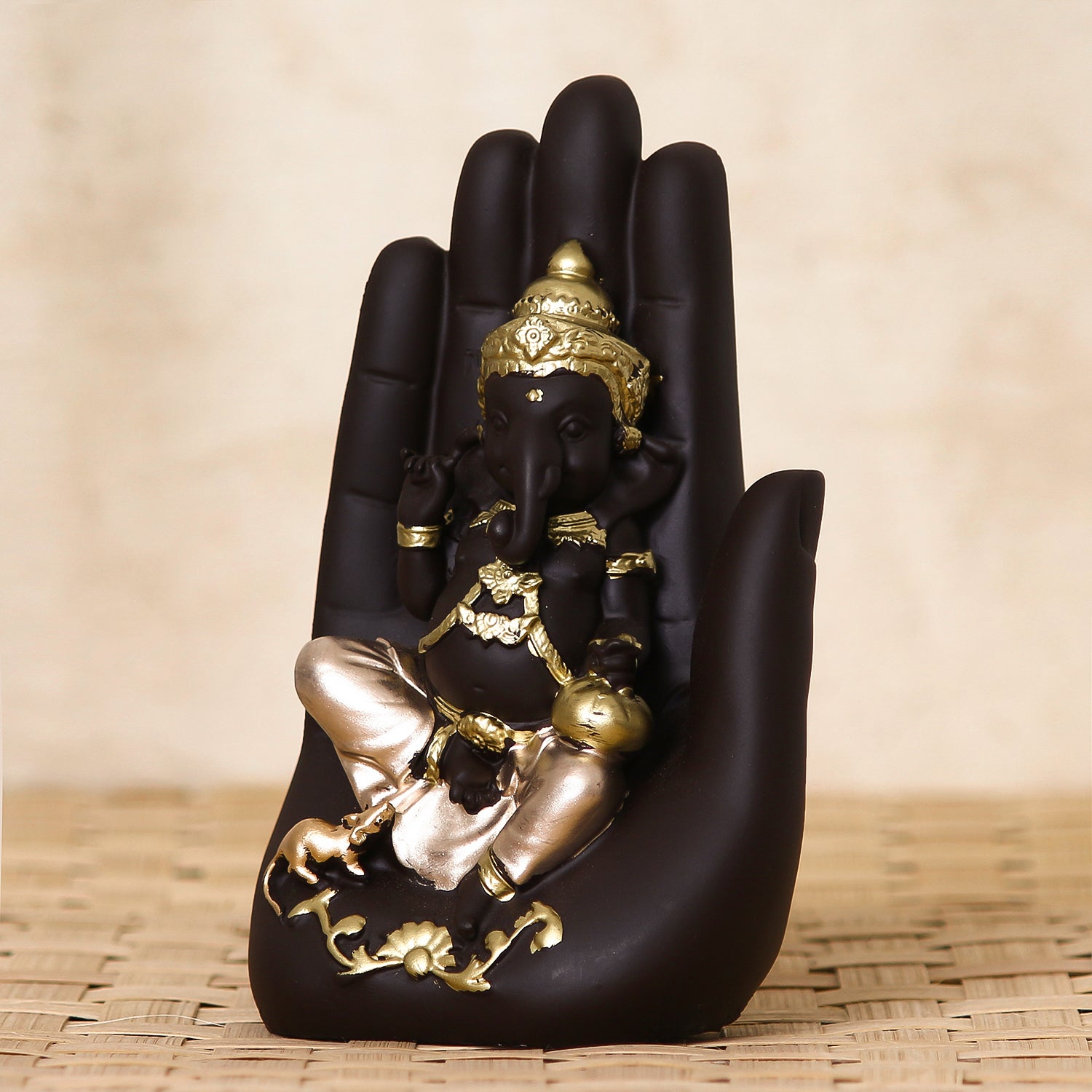 Golden Palm Ganesha Showpiece: Handcrafted Decor